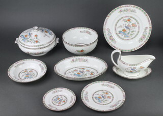 A Wedgwood Kutani Crane dinner service comprising 8 small plates, 8 side plates, 8 dinner plates, 8 soup bowls, 2 deep bowls, an oval dish, an oval meat plate, sauce boat and stand, 2 tureens and covers 