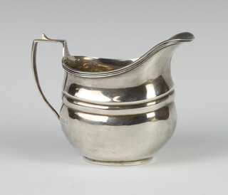 A silver cream jug of Georgian design Birmingham 1929, 9cm, 92 grams 