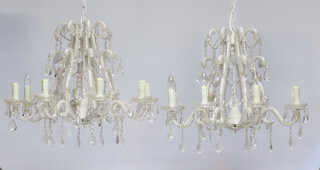 An impressive pair of wrought metal and glass 8 light electroliers hung lozenges 60cm h x 70cm diam. 