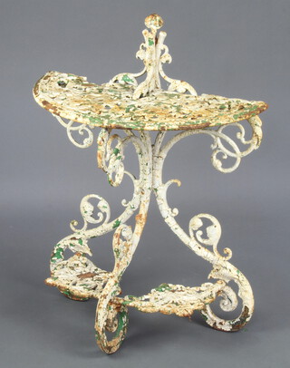 A Victorian style painted and pierced cast iron semi-circular plant stand 87cm h x 65cm w x 34cm d  