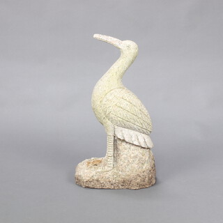 A carved granite figure of a standing stork 53cm h x 29cm w x 18cm d 