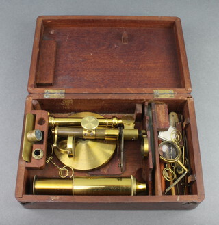 A 19th Century gilt metal single pillar student's field microscope 26cm h x 8cm, contained in a mahogany case 