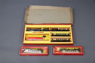 A Triang Dublo electric train set RS.23 comprising locomotive, tender and 3 carriages (no rails) boxed (box damaged), 2 Triang Hornby B228 pulman carriages Ruth and Mary boxed
