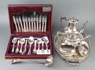 A silver plated 4 piece demi-fluted tea set, cased canteen, tray and ladle