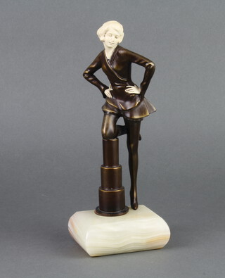 An Art Deco style bronze and resin figure of a lady standing by a pedestal, raised on a rectangular white marble base 25cm h x 9cm w x 3cm d 