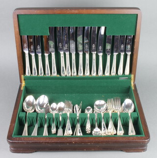 A canteen of silver plated cutlery for 8 with beaded decoration in a fitted mahogany finished canteen (84 pieces)