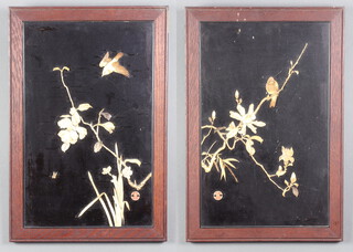 A pair of Japanese Meiji period lacquered panels with bone decoration depicting birds amongst flowers with a seal mark 45cm x 29cm 