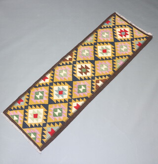 A black, green and white ground Maimana Kilim runner with overall diamond design 208cm x 66cm 