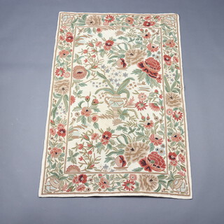 A Kashmiri stitched panel decorated an urn of flowers surrounded by flowers 158cm x 106cm 