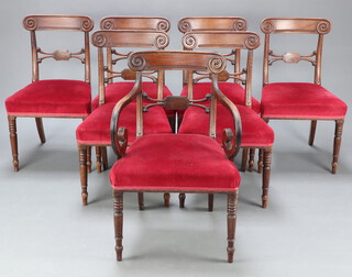 A set of 7 Regency bar back dining chairs with carved mid rails and over stuffed seats, raised on turned supports comprising 1 carver 85cm h x 54cm w x 44cm (seat 36cm x 32cm) and 6 standard chairs 85cm h x 47cm w x 41cm d (seat 34cm x 30cm), 