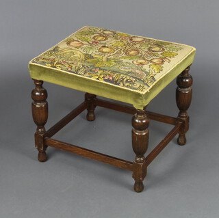 A 17th Century style beech stool the seat with Berlin wool work panel decorated a tree and mythical beasts, raised on cup and cover supports 45cm h x 52cm w x 47cm d 