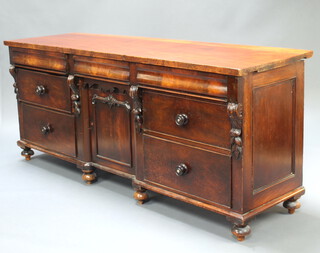 A Victorian mahogany sideboard fitted 3 secret drawers above cupboard enclosed by a panelled door, flanked by 4 short drawers, raised on bun feet 84cm h x 199cm w x 57cm d 