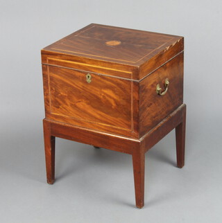 A 19th Century inlaid mahogany rectangular cellarette with hinged lid and fitted interior of 12 recesses, having brass drop handles, raised on a later square tapered supports 61cm h x 47cm w x 42cm d 