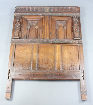 A section of 17th/18th Century carved oak panelling used as a headboard 176cm h x 124cm w 10cm 

