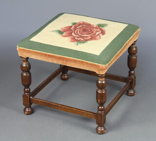 A 1930's, 17th Century style, square stool with Berlin woolwork seat decorated a rose, raised on cup and cover supports 45cm h x 56cm w x 56cm d 