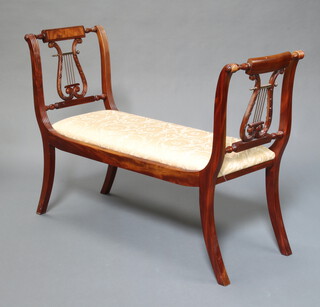A Regency style mahogany window seat with lyre decoration and upholstered seat, raised on scroll supports 86cm h x 121cm w x 45cm  (seat 80cm x 27cm) 