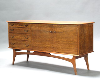 A C Alfred Cox for Heals, a mid-Century walnut sideboard fitted 4 drawers with drop handles flanked by a cupboard enclosed by a pair of panelled doors 80cm h x 159cm w x 49cm d, labelled to right hand door Handcrafted Quality Reg. Trademark Furniture AC  