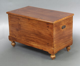 A 19th Century stripped and polished pine coffer with hinged lid, interior fitted 2 drawers with iron drop handles, raised on bun feet 60cm h x 94cm w x 51cm d 