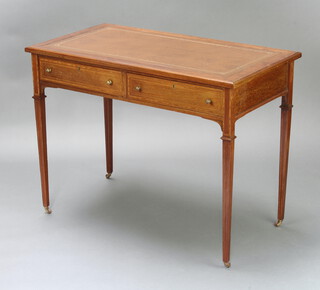 An Edwardian inlaid mahogany writing table with brown inset writing surface, base fitted 2 raised on square tapered supports 75cm h x 99cm w x 54cm d  