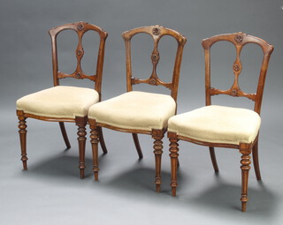 A pair of Victorian walnut slat back dining chairs with overstuffed seats, raised on turned and fluted supports 87cm h x 46cm w x 41cm d (seat 25cm x 26cm)  