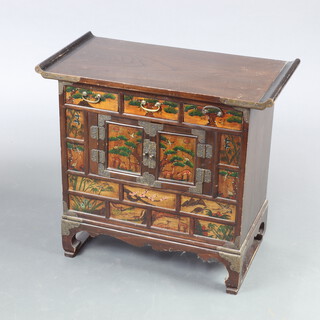 A 20th Century Chinese cabinet fitted 3 drawers above cupboard enclosed by panelled doors 58cm h x 64cm w x 33cm d 