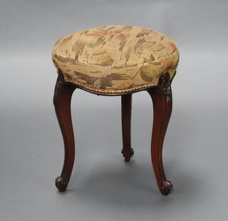 A Victorian circular carved rosewood stool with overstuffed seat, raised on cabriole supports 45cm x 37cm 