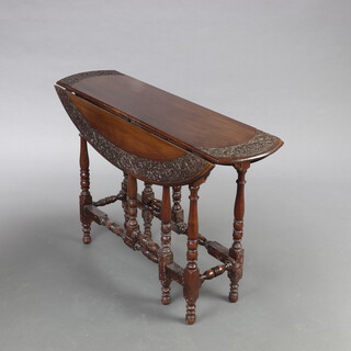 An Edwardian Anglo Indian carved hardwood drop flap gateleg spiders leg tea table, raised on turned supports 62cm h x 93cm w x 24cm (when closed) x 60cm when open 