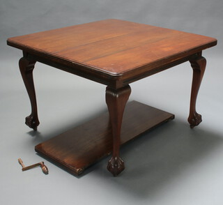 A Chippendale style rectangular mahogany extending dining table, raised on cabriole, ball and claw supports 73cm h x 105cm w x 107cm when closed x 150cm l with extended, complete with winder 