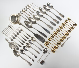 An 800 standard fiddle pattern ladle, eighteen 800 standard gold plated tea spoons and minor flatware 1050 grams 