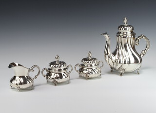 A Sterling 925 German coffee set with spiral fluted decoration comprising coffee pot, cream jug and 2 lidded sugar bowls on scroll feet 960 grams gross 