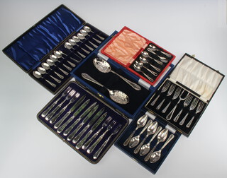 A quantity of cased silver plated ribbon and bow pattern cutlery comprising 6 coffee spoons, 12 teaspoons and nips, a pair of berry spoons, 7 cake forks, 6 grapefruit spoons, 6 dessert knives and forks 