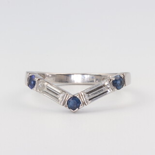 A BOODLES 18ct white gold baguette cut 2 stone diamond and brilliant cut 3 stone sapphire ring, the diamonds 0.8ct, the sapphires 0.3ct, 3.6 grams, size O