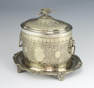 An Edwardian oval silver plated repousse biscuit barrel with bird finial on scroll feet 19cm 