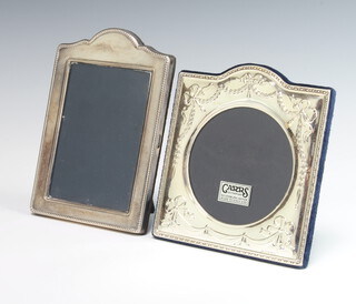 A modern silver dome topped photograph frame with beaded decoration 17cm, a square dome topped repousse ditto with swags and ribbons 15cm 