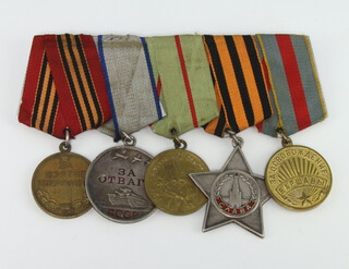 A group of five Soviet Union medals comprising The Medal For The Capture of Berlin, Medal of Valour no.2176969, The Medal For The Defence of Stalingrad, The Silver Order of Glory 2nd Class, The Medal For The Liberation of Warsaw mounted as one 
