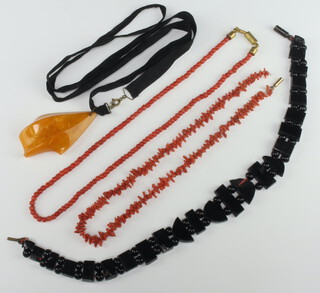 A coral bead necklace 44cm, 1 other, a jet necklace and an amberoid pendant 