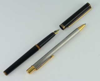 A Cartier polished steel ballpoint pen no.276762 together with a Dupont fountain pen stamped 925 