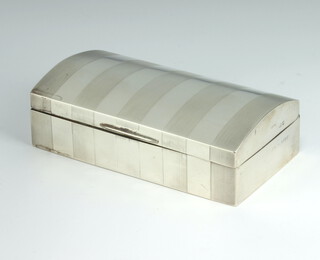 A silver dome topped engine turned cigarette box with engraved inscription Birmingham 1924, 16cm 
