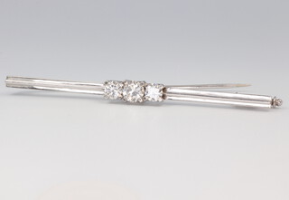A white metal stamped 585 3 stone diamond brooch 0.25ct, 0.5ct, 0.25ct, 5.1 grams, 63mm, colour F/G, VVS2  