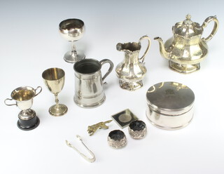 A circular silver plated biscuit box 15cm, a Victorian plated teapot and milk jug and other minor plated wares 