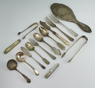 An Edwardian Art Nouveau silver hand mirror back, London 1905 and minor silver cutlery, weighable silver 216 grams 