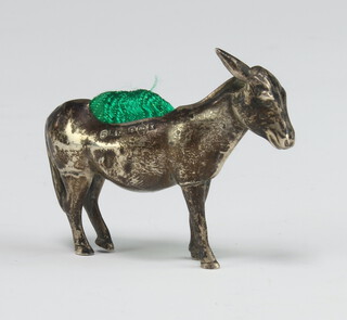 A novelty silver pin cushion in the form of a standing donkey Birmingham 1922, 5cm 