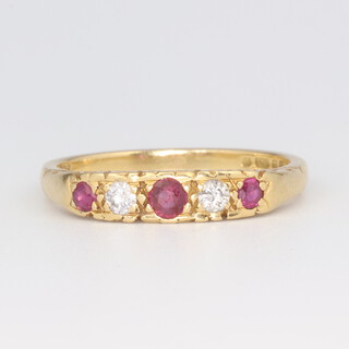 An 18ct yellow gold ruby and diamond ring with 2 brilliant cut diamonds each 0.07ct, rubies 0.2ct, 3.8 grams