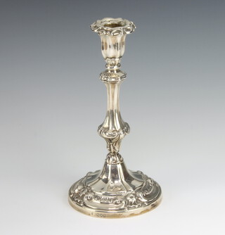 A Victorian silver Rococo style candlestick with scroll decoration London 1899, 25cm 