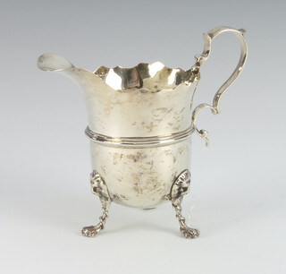 A Victorian silver helmet shaped cream jug with S scroll handle, London 1898, 120 grams 