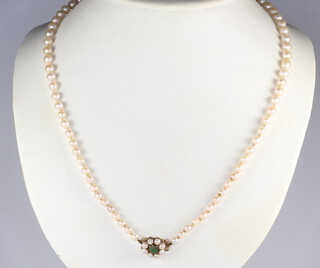 A graduated cultured pearl necklace with seed pearl clasp 52cm 