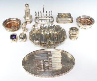 An Edwardian silver plated circular salver with shell and pie crust rim 25cm, a pair of wine bottle coasters and minor plated wares