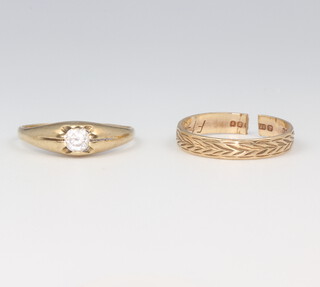 Two gentleman's yellow gold signet rings 1 with a brilliant cut diamond 0.02ct, 1 has a cut shank, 1.0 grams 