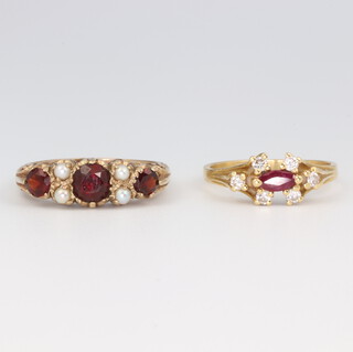A yellow metal garnet and pearl ring, size Q, 3.4 grams together with a ruby and diamond 18ct yellow gold ditto 3.5 grams, size N, 