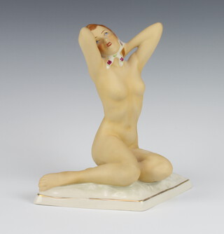 A Royal Dux matt figure of a seated naked lady wearing a floral head scarf on a triangular base 205 20cm 